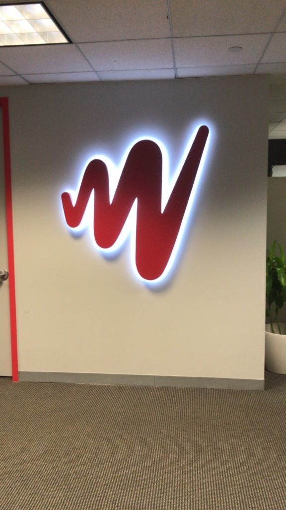 Halo-lit corporate logo signage office lobby NYC