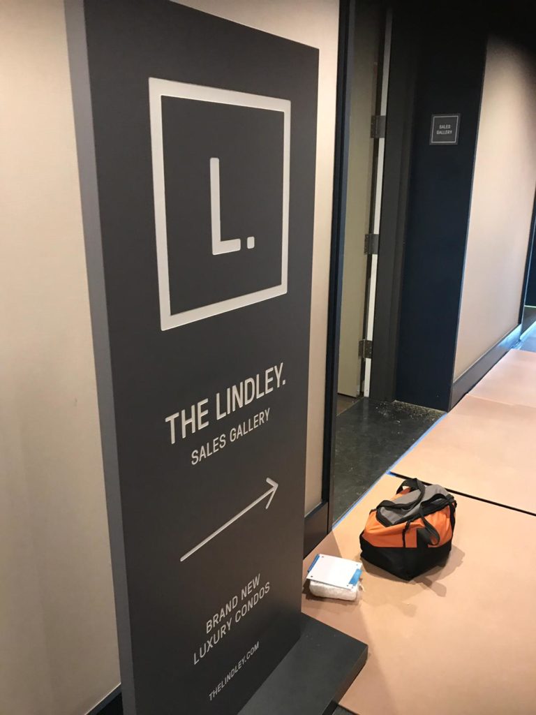 Directional etched sign